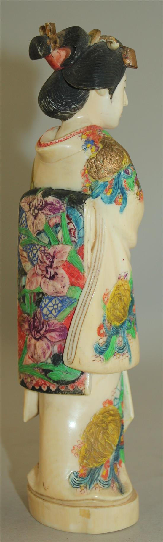 A Japanese coloured ivory figure of a bijin, early 20th century, 21cm